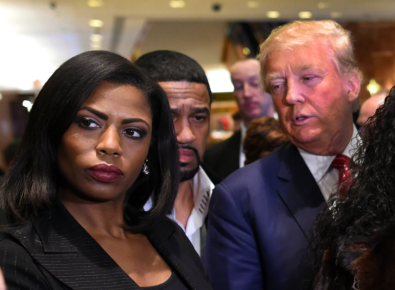 Omarosa Manigault appears alongside Donald Trump during a press conference Nov. 30, 2015, that followed Trump’s meeting with African-American religious leaders in New York City.TIMOTHY A. CLARY/AFP/Getty Images